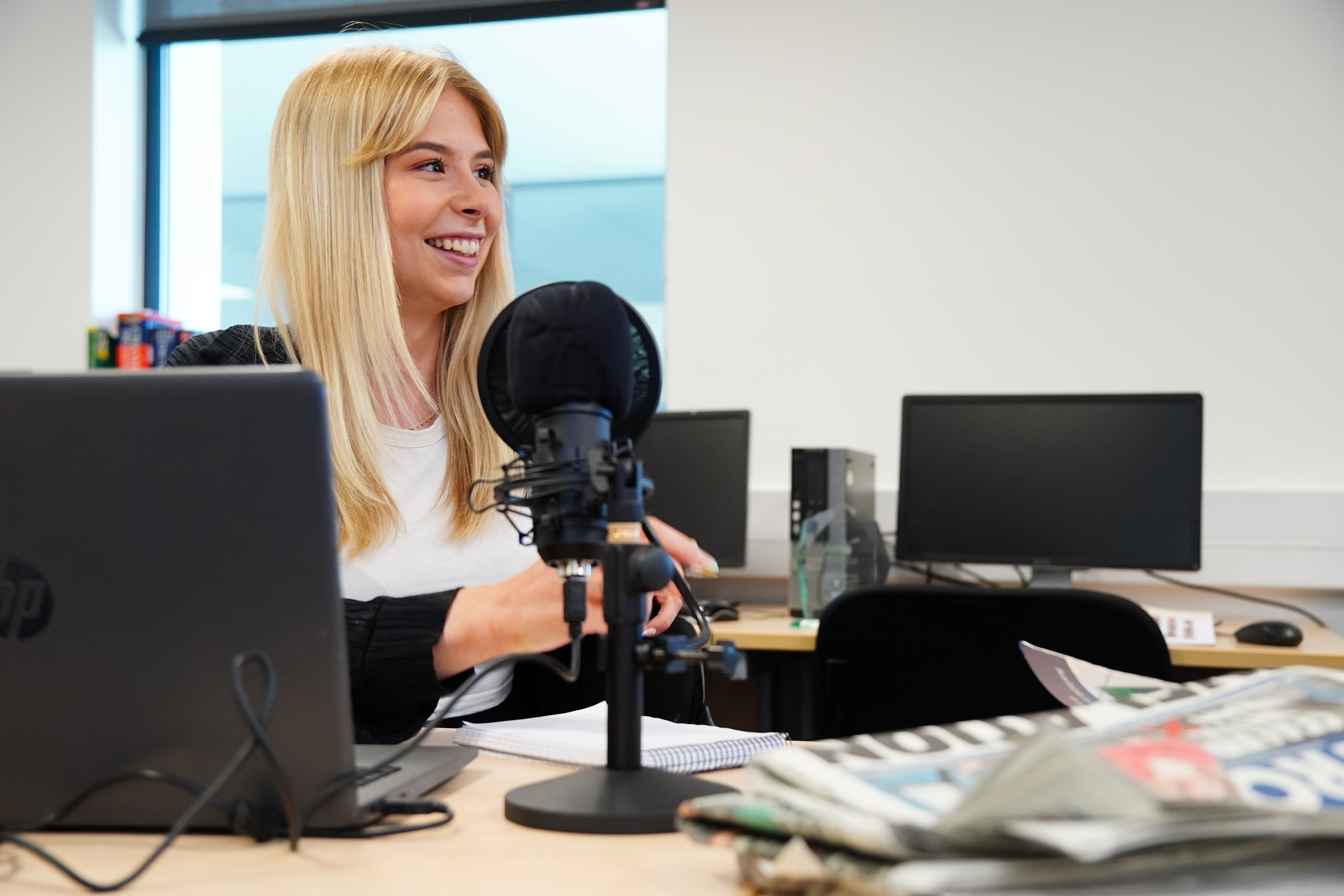 Young female journalism student smiling